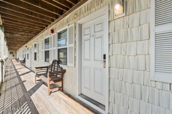 1505 N New River Dr Unit 210, Surf City, NC 28445 - doorway to property with a porch