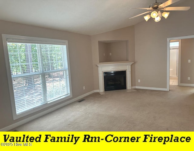 12 Deerwood Ln, Pinehurst, NC 28374 - unfurnished living room with lofted ceiling, carpet flooring, baseboards, a fireplace with flush hearth, and ceiling fan