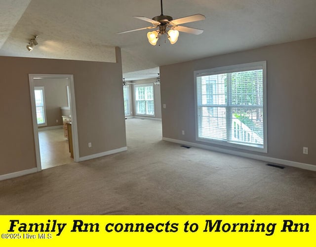12 Deerwood Ln, Pinehurst, NC 28374 - carpeted empty room featuring ceiling fan, baseboards, a textured ceiling, and track lighting
