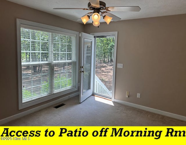 12 Deerwood Ln, Pinehurst, NC 28374 - unfurnished room with carpet floors, a ceiling fan, and baseboards