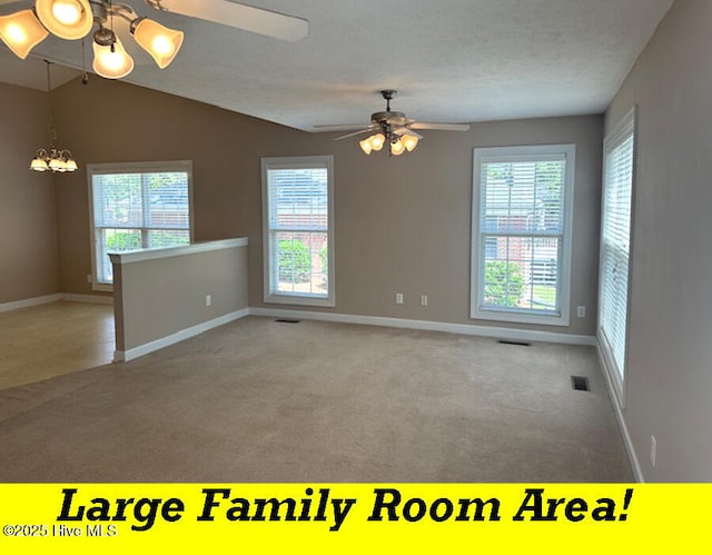 12 Deerwood Ln, Pinehurst, NC 28374 - carpeted empty room featuring a ceiling fan, baseboards, a chandelier, and lofted ceiling
