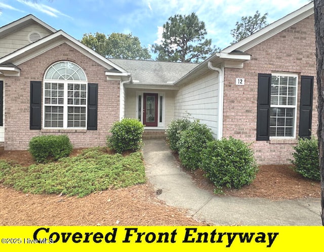 12 Deerwood Ln, Pinehurst, NC 28374 - entrance to property featuring brick siding