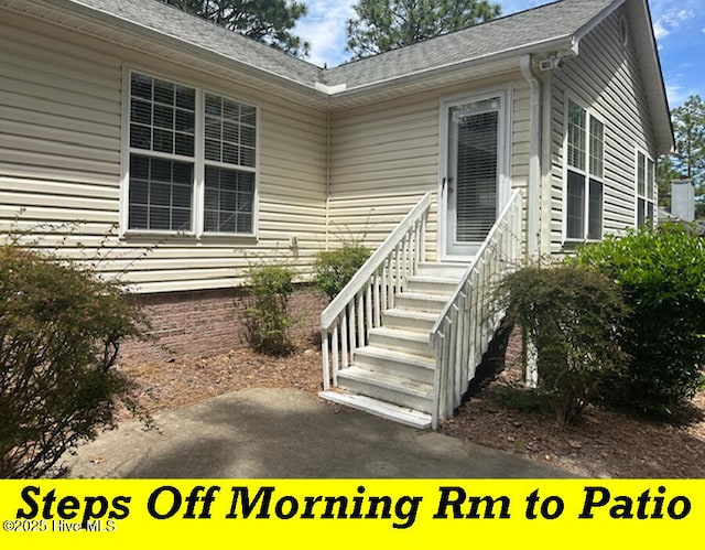 12 Deerwood Ln, Pinehurst, NC 28374 - doorway to property featuring a shingled roof