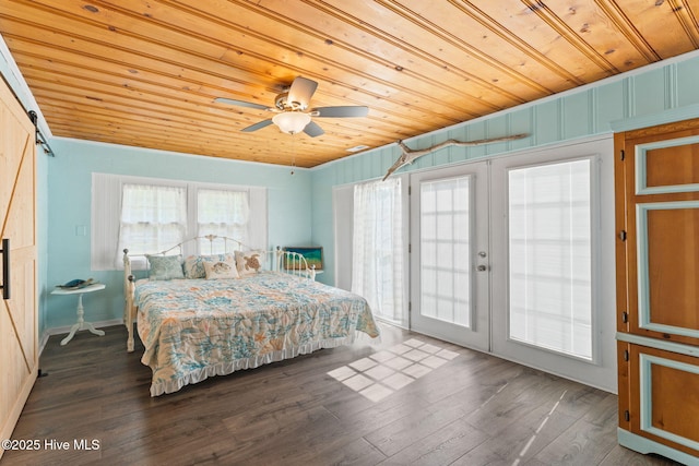 115 NE 66th St, Oak Island, NC 28465 - bedroom featuring wood ceiling, french doors, access to outside, wood finished floors, and a barn door