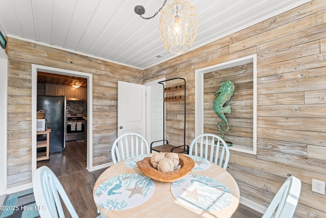 115 NE 66th St, Oak Island, NC 28465 - dining area with wood walls and baseboards