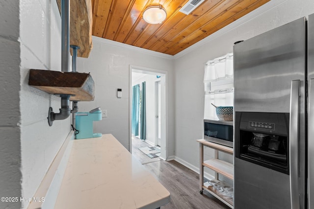 115 NE 66th St, Oak Island, NC 28465 - kitchen with appliances with stainless steel finishes, wooden ceiling, light stone counters, wood finished floors, and crown molding
