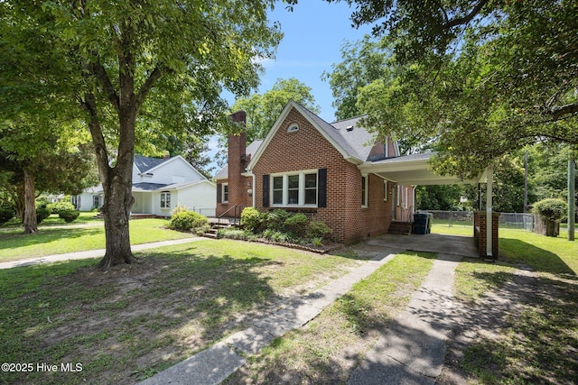 1208 N Bonner St, Washington, NC 27889 - view of front of home with brick siding, driveway, and a carport