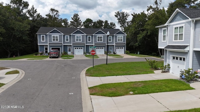 11 Acacia Rd, Hampstead, NC 28443 - view of asphalt street featuring sidewalks, traffic signs, and curbs