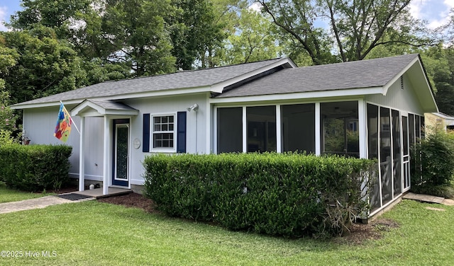 215C Battleground Ave, New Bern, NC 28560 - ranch-style house with roof with shingles, a front lawn, and a sunroom