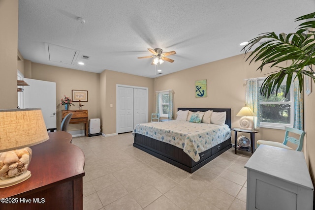 215C Battleground Ave, New Bern, NC 28560 - bedroom featuring attic access, a closet, light tile patterned flooring, multiple windows, and recessed lighting