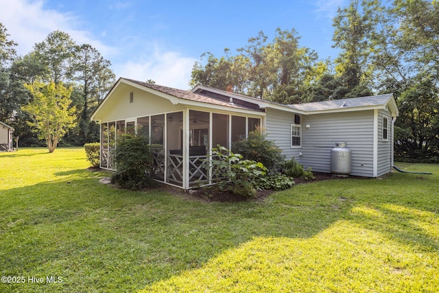 215C Battleground Ave, New Bern, NC 28560 - rear view of property featuring a lawn, a sunroom, and roof with shingles