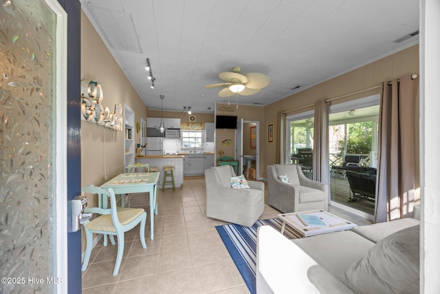 215C Battleground Ave, New Bern, NC 28560 - living room with light tile patterned floors, healthy amount of natural light, and ceiling fan