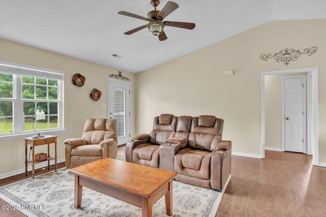 136 Van Riggs Rd, Hubert, NC 28539 - living area with lofted ceiling, a ceiling fan, and wood finished floors