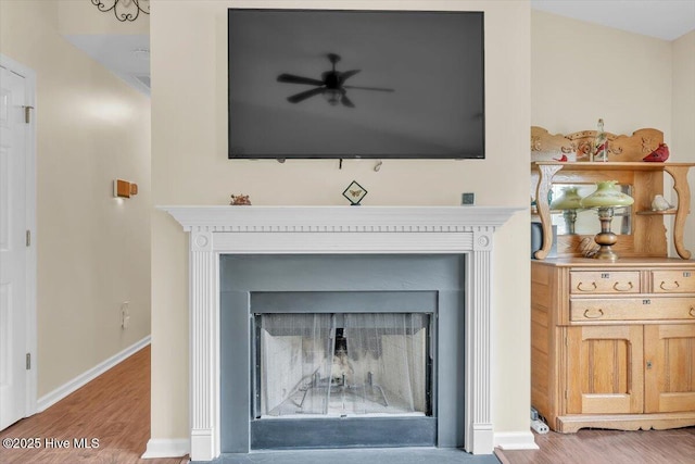 136 Van Riggs Rd, Hubert, NC 28539 - detailed view of wood finished floors, a fireplace, and a ceiling fan