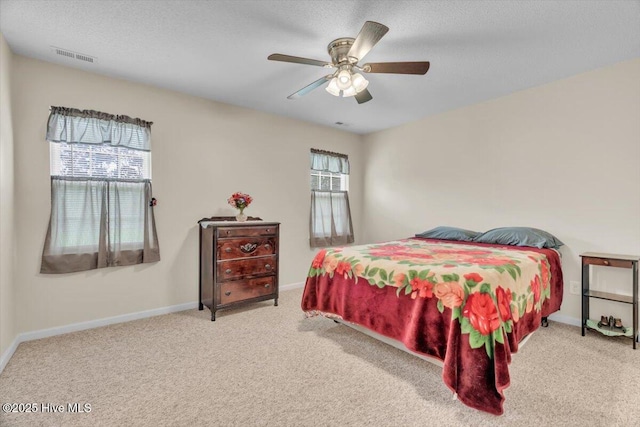 136 Van Riggs Rd, Hubert, NC 28539 - carpeted bedroom featuring a textured ceiling and a ceiling fan