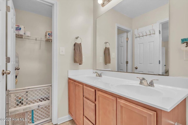 136 Van Riggs Rd, Hubert, NC 28539 - bathroom featuring double vanity and a spacious closet