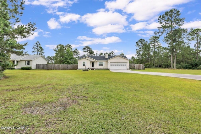 136 Van Riggs Rd, Hubert, NC 28539 - single story home featuring concrete driveway, a garage, and a chimney