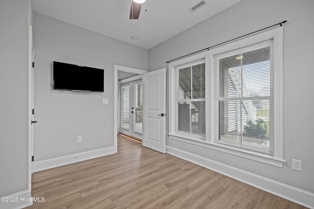 520 Cannonsgate Dr, Newport, NC 28570 - empty room with light wood-type flooring, a ceiling fan, and plenty of natural light