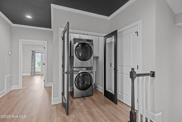 520 Cannonsgate Dr, Newport, NC 28570 - washroom featuring stacked washer / dryer, light wood-type flooring, and ornamental molding