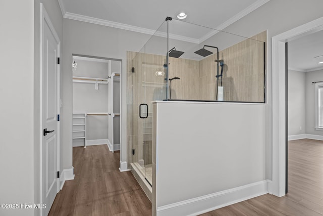 520 Cannonsgate Dr, Newport, NC 28570 - full bath featuring a shower stall, a walk in closet, wood finished floors, ornamental molding, and recessed lighting