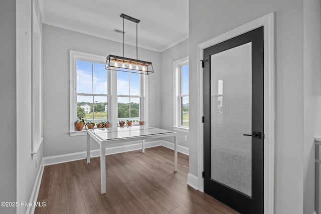 520 Cannonsgate Dr, Newport, NC 28570 - foyer entrance with dark wood finished floors, ornamental molding, and a chandelier