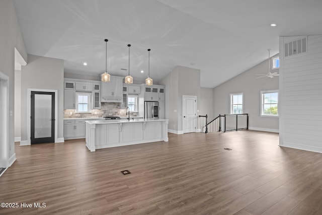 520 Cannonsgate Dr, Newport, NC 28570 - kitchen featuring smart refrigerator, light countertops, open floor plan, an island with sink, and wood finished floors