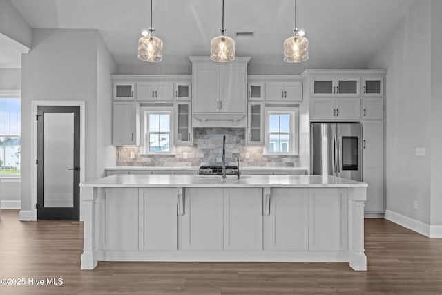 520 Cannonsgate Dr, Newport, NC 28570 - kitchen featuring smart refrigerator, light countertops, an island with sink, and tasteful backsplash