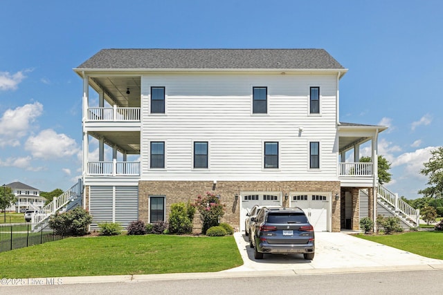 520 Cannonsgate Dr, Newport, NC 28570 - coastal home with stairway, concrete driveway, and an attached garage
