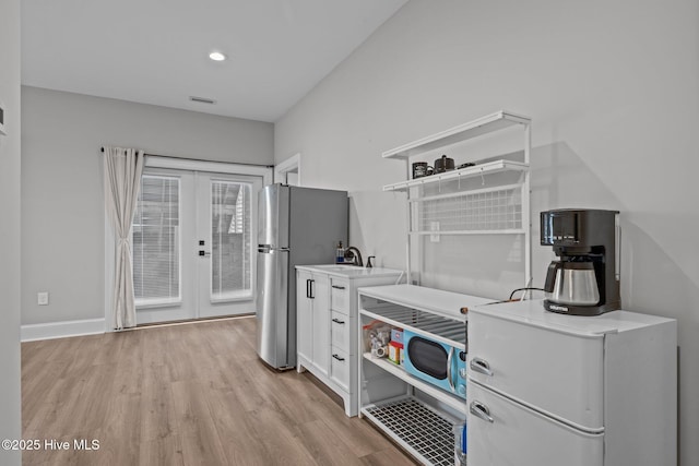 520 Cannonsgate Dr, Newport, NC 28570 - laundry room with light wood-style floors, french doors, and recessed lighting