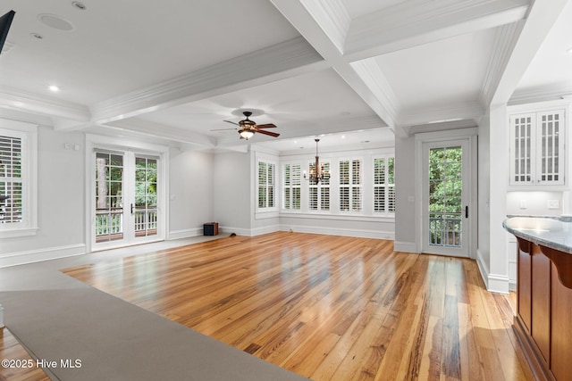 733 Legare Ln SW, Supply, NC 28462 - unfurnished living room featuring light wood-style floors, baseboards, crown molding, beam ceiling, and coffered ceiling