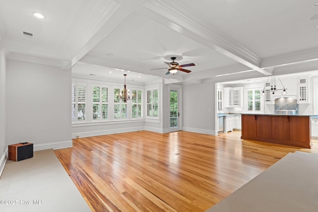 733 Legare Ln SW, Supply, NC 28462 - unfurnished living room with a chandelier, crown molding, light wood-style floors, baseboards, and beam ceiling