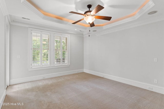 733 Legare Ln SW, Supply, NC 28462 - carpeted spare room with a raised ceiling, ornamental molding, a ceiling fan, and baseboards