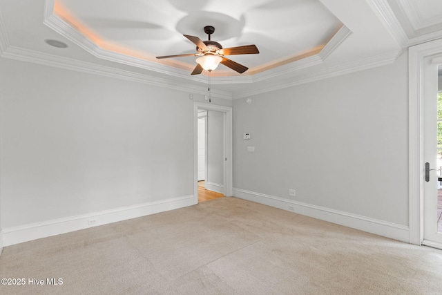 733 Legare Ln SW, Supply, NC 28462 - spare room with light colored carpet, a raised ceiling, ceiling fan, crown molding, and baseboards