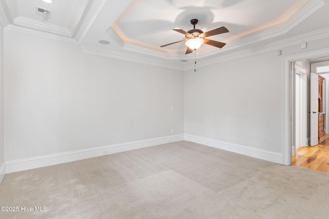 733 Legare Ln SW, Supply, NC 28462 - empty room featuring a raised ceiling, ornamental molding, carpet flooring, a ceiling fan, and baseboards