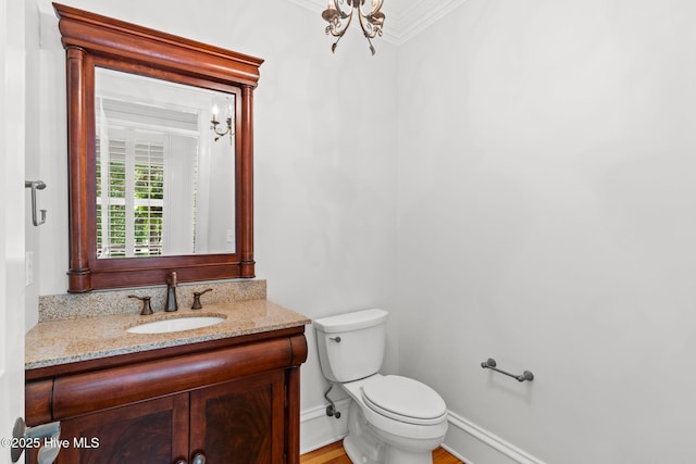 733 Legare Ln SW, Supply, NC 28462 - bathroom with vanity, toilet, ornamental molding, and a chandelier
