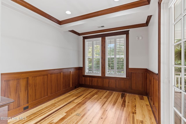 733 Legare Ln SW, Supply, NC 28462 - unfurnished room with wainscoting, ornamental molding, light wood-style flooring, wooden walls, and recessed lighting