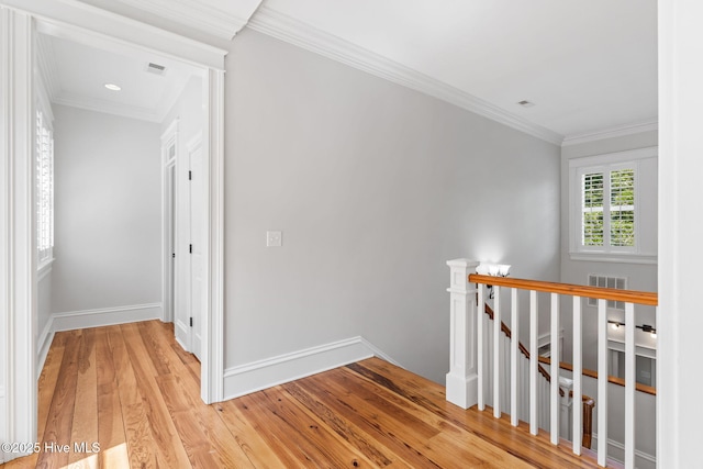 733 Legare Ln SW, Supply, NC 28462 - hallway featuring an upstairs landing, light wood-type flooring, ornamental molding, and baseboards