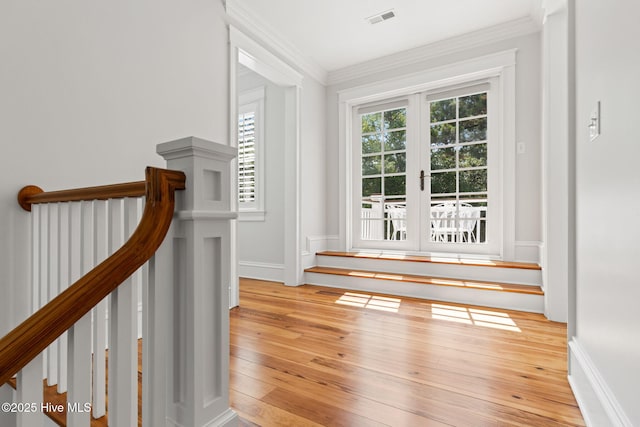 733 Legare Ln SW, Supply, NC 28462 - hall with crown molding, light wood-type flooring, baseboards, and an upstairs landing