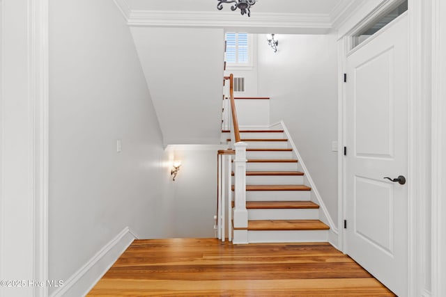 733 Legare Ln SW, Supply, NC 28462 - stairway featuring ornamental molding, wood finished floors, and baseboards