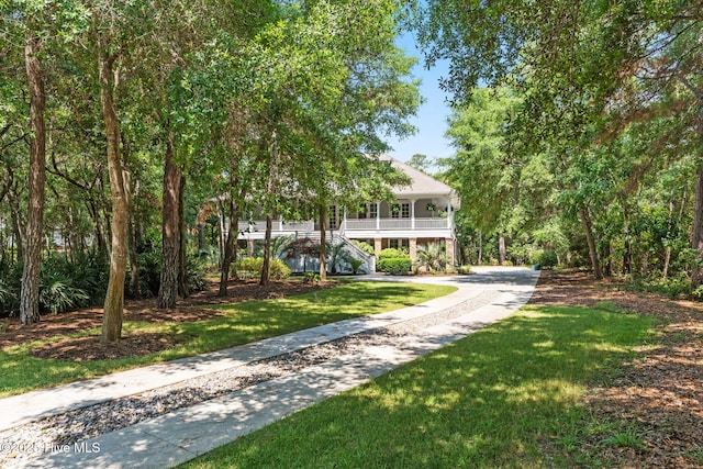 733 Legare Ln SW, Supply, NC 28462 - view of home's community with stairs, a yard, and dirt driveway