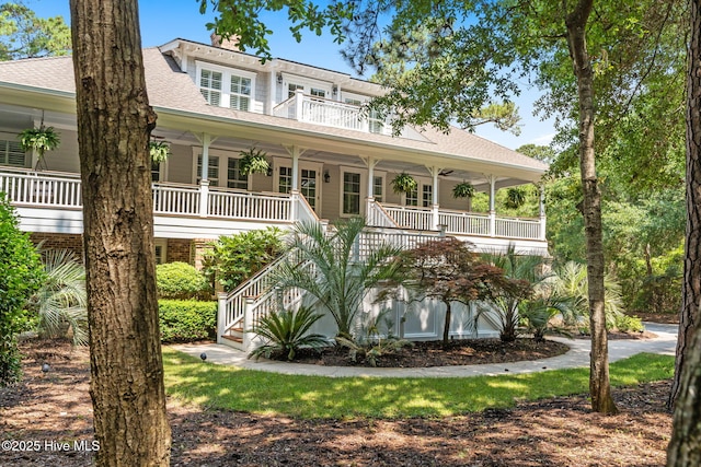 733 Legare Ln SW, Supply, NC 28462 - view of front of home featuring covered porch, a shingled roof, and stairs