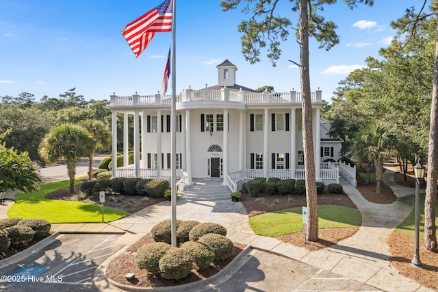 733 Legare Ln SW, Supply, NC 28462 - view of front of property with a porch, a balcony, and uncovered parking