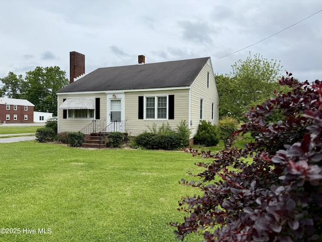 110 N Main St, Colerain, NC 27924 - cape cod house featuring a chimney and a front lawn