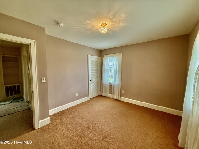 110 N Main St, Colerain, NC 27924 - unfurnished bedroom with carpet floors, baseboards, and a closet