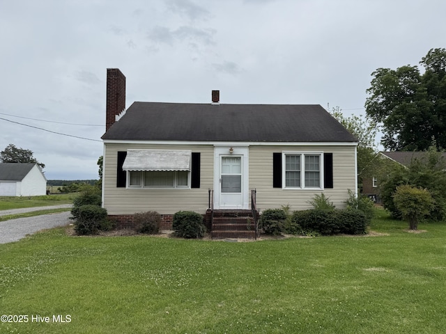 110 N Main St, Colerain, NC 27924 - cape cod home with a front yard, entry steps, and a chimney