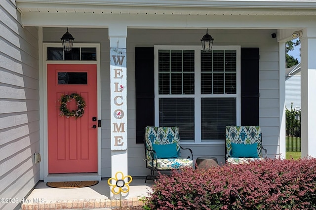 502 Vanderhorst Ave, Shallotte, NC 28470 - doorway to property with covered porch