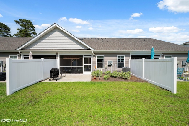 6476 Merceron St Unit 2B, Ocean Isle Beach, NC 28469 - rear view of house featuring a patio, roof with shingles, and a sunroom
