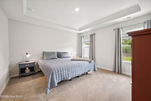 6476 Merceron St Unit 2B, Ocean Isle Beach, NC 28469 - carpeted bedroom featuring a raised ceiling and ornamental molding