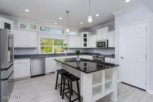 225 Factory Rd, Hampstead, NC 28443 - kitchen with stainless steel appliances, open shelves, white cabinets, light wood-style floors, and recessed lighting