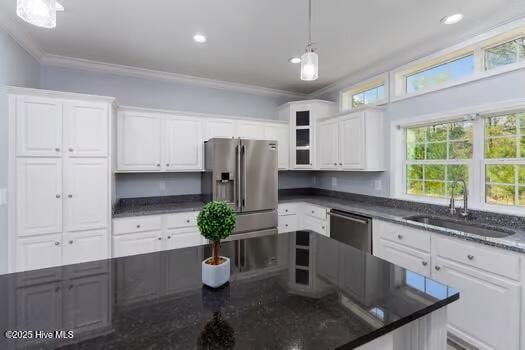 225 Factory Rd, Hampstead, NC 28443 - kitchen featuring stainless steel appliances, a sink, crown molding, white cabinetry, and pendant lighting